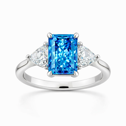 Étoile Bleu — Radiant-Cut Three-Stone Blue Diamond Ring