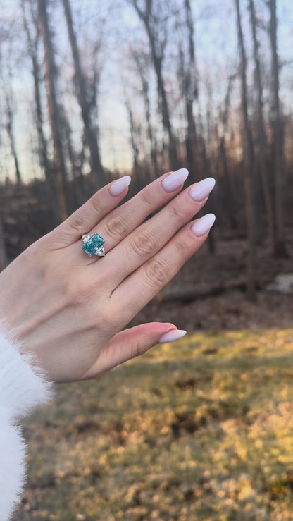Étoile Bleu — Radiant-Cut Three-Stone Blue Diamond Ring